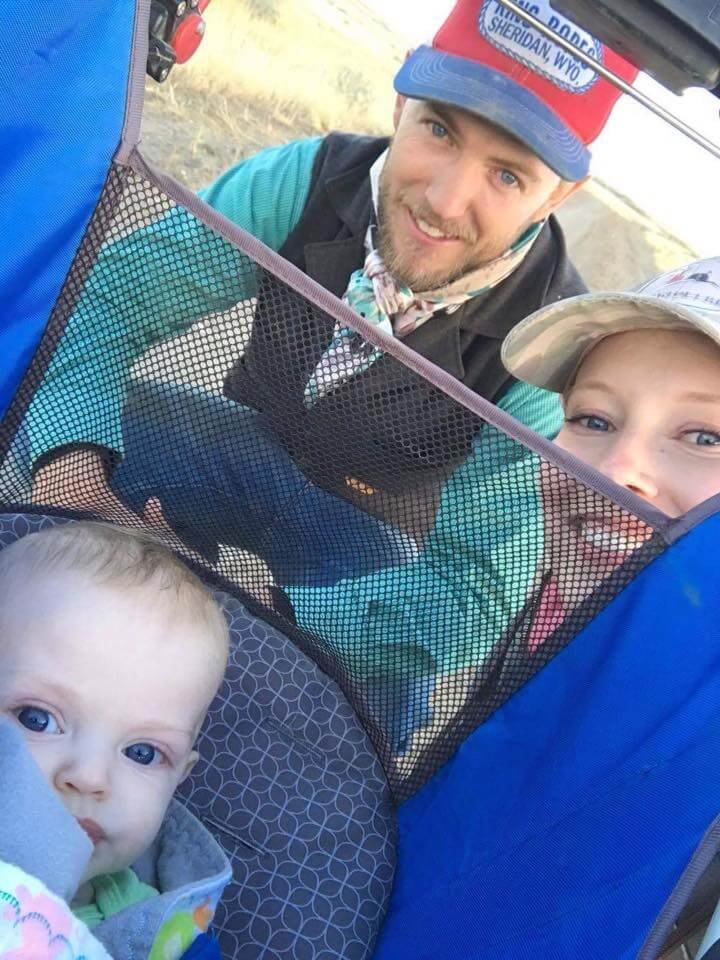 mom and dad on a walk with baby in a stroller